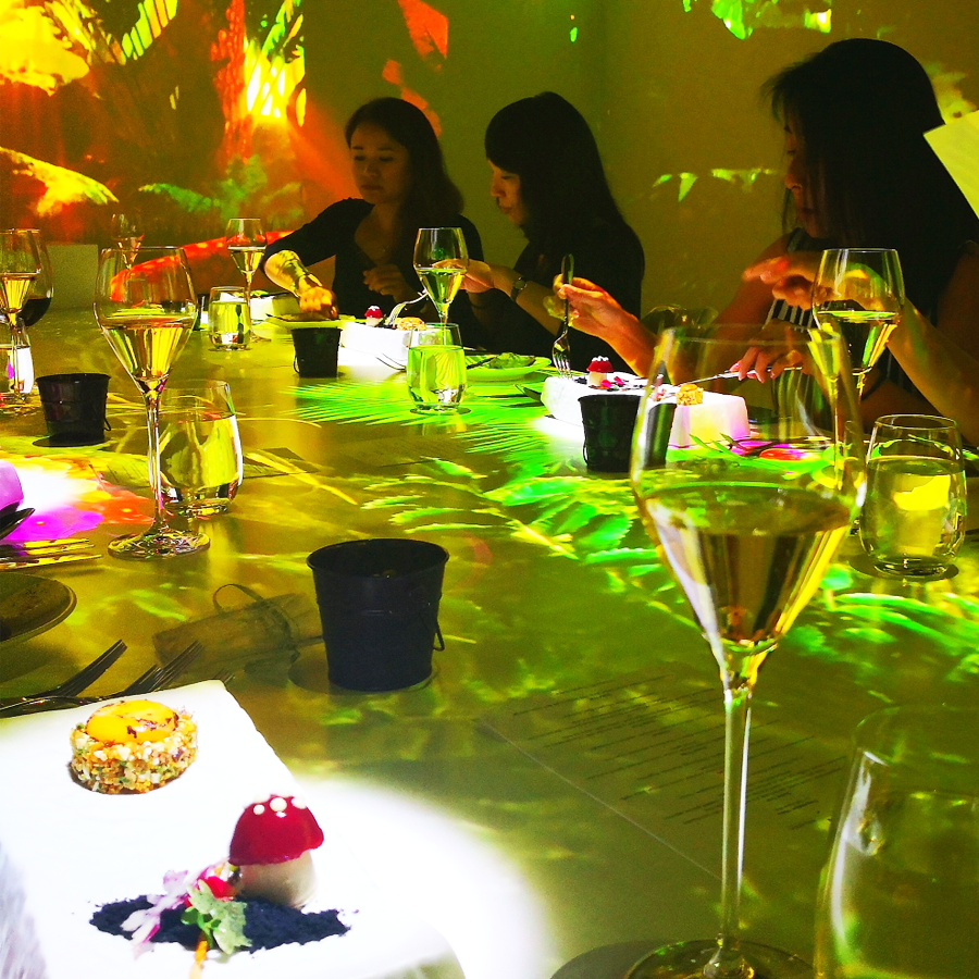 Guests dining in CRAVE 4D ambience